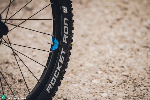 The stock Schwalbe Rocket Ron Performance tires are likely to puncture, and only offer minimal grip for real trail adventures.