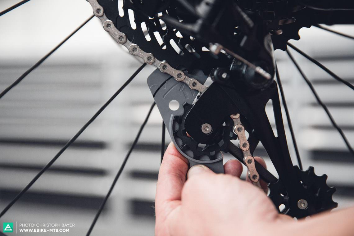 If the chain is on the biggest cog then you can adjust the chain gap (derailleur tension). The chain gap is the distance between the largest sprocket and the upper jockey wheel, and it should be about 12-14 mm. SRAM provide a gauge, which simplifies this adjustment.